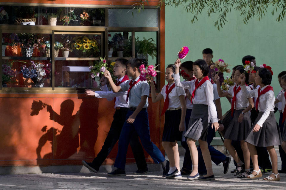 School children march in a group as the capital prepares for the 70th anniversary of North Korea's founding day in Pyongyang, North Korea, Friday, Sept. 7, 2018. North Korea will be staging a major military parade, huge rallies and reviving its iconic mass games on Sunday to mark its 70th anniversary as a nation. (AP Photo/Ng Han Guan)