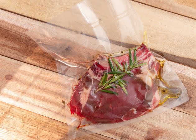 A piece of vacuum-sealed beef awaits the immersion circulator. (Photo: annick vanderschelden photography via Getty Images)