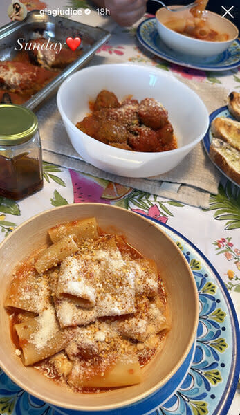 Food in plates in pans on a table.