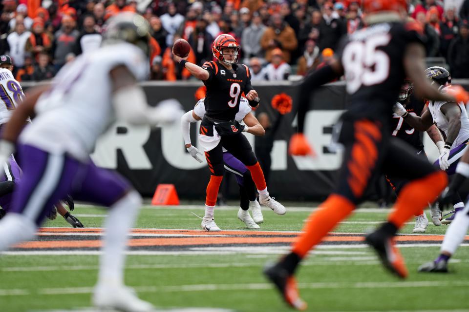 Jan 8, 2023; Cincinnati, Ohio, USA; Cincinnati Bengals quarterback Joe Burrow (9) throws out of the pocket in the first quarter of a Week 18 NFL game against the Baltimore Ravens at Paycor Stadium in Cincinnati. Mandatory Credit: Kareem Elgazzar-The Cincinnati Enquirer-USA TODAY Sports