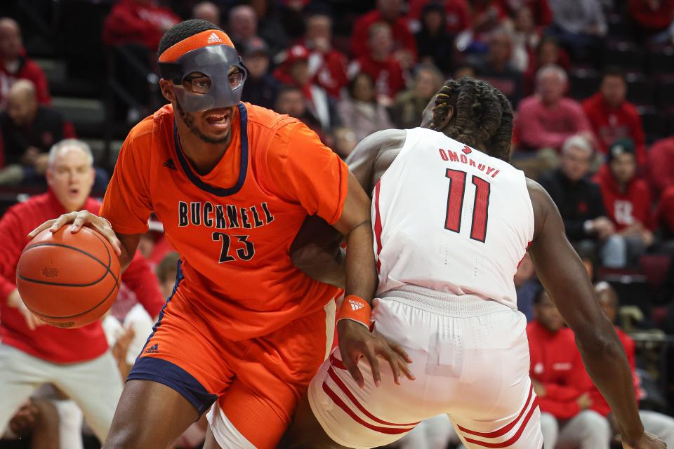 Dec 23, 2022; Piscataway, New Jersey, USA; Bucknell Bison center Andre Screen (23) dribbles against Rutgers Scarlet Knights center Clifford Omoruyi (11) during the first half at Jersey Mike's Arena.