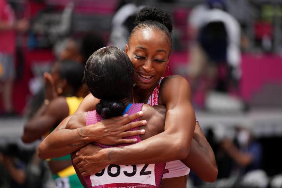 Jasmine Camacho-Quinn, of Puerto Rico, hugs Kendra Harrison, of United States, after the women’s 100-meter hurdles final at the 2020 Summer Olympics, Monday, Aug. 2, 2021, in Tokyo. (AP Photo/Matthias Schrader)