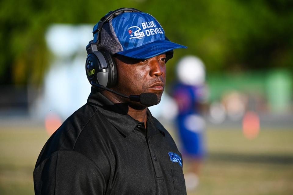 The Pahokee Blue Devils head coach Emmanuel Hendrix is seen on the sidelines during the spring football game between Pahokee and St. John Paul II at St. John Paull II Academy in Boca Raton, FL, on Thursday, May 27, 2021. Final score, Pahokee, 20, St. John Paul II, 14.