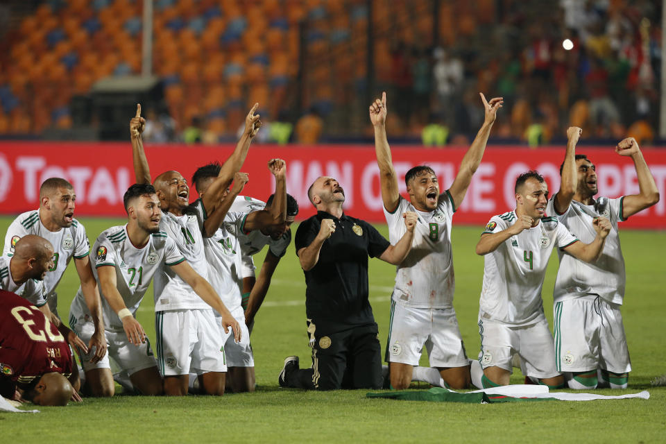 Algerian players celebrate after the African Cup of Nations final soccer match between Algeria and Senegal in Cairo International stadium in Cairo, Egypt, Friday, July 19, 2019. (AP Photo/Ariel Schalit)