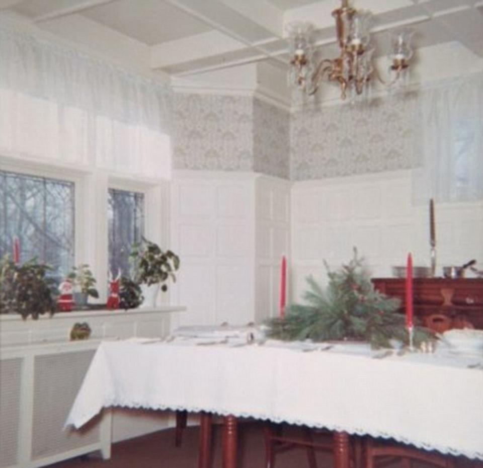 The stately home, which has six bedrooms, is nestled on a quite street about 28 miles from Manhattan; its high-ceilinged dining room is pictured in this Christmas photo taken by a previous owner (Margaret Bakes Davis)