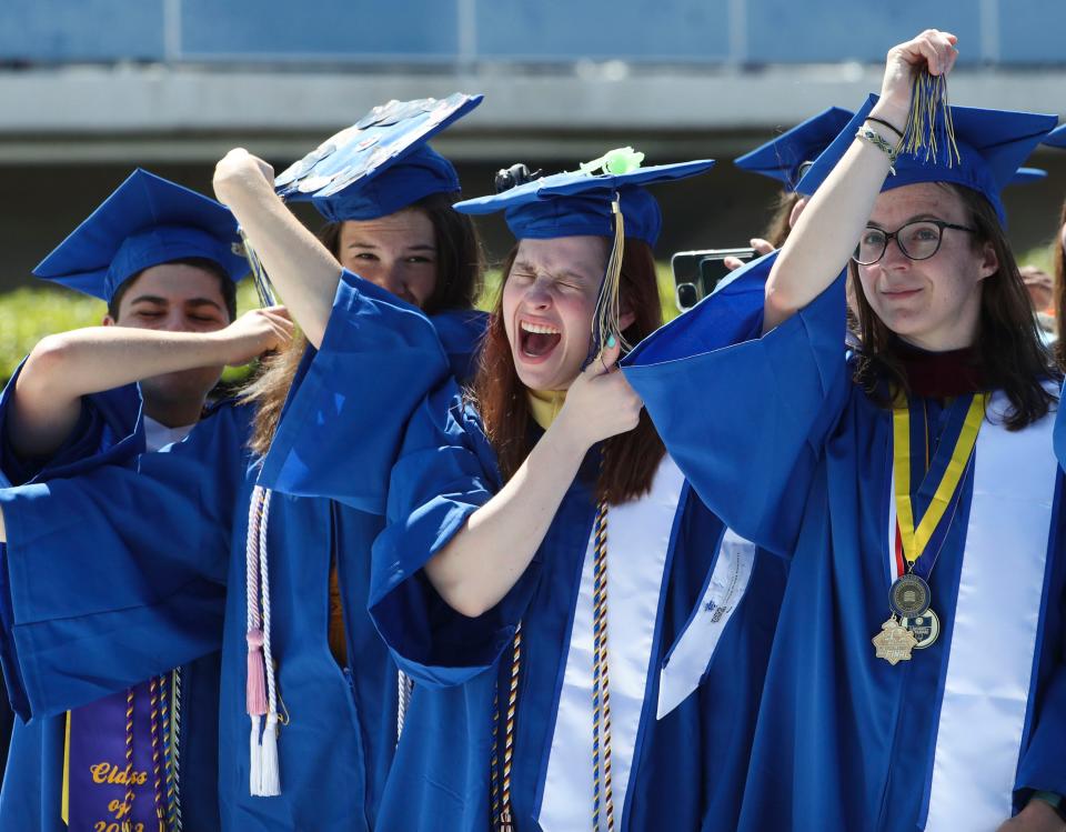 Graduates participate in the tassel ceremony at the conclusion of the University of Delaware's 2023 Commencement at Delaware Stadium, Saturday, May 27, 2023.