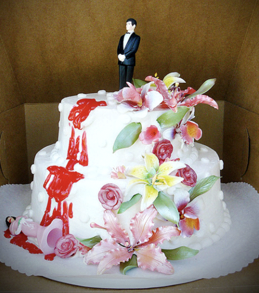 Cake toppers that look like the groom killed the bride