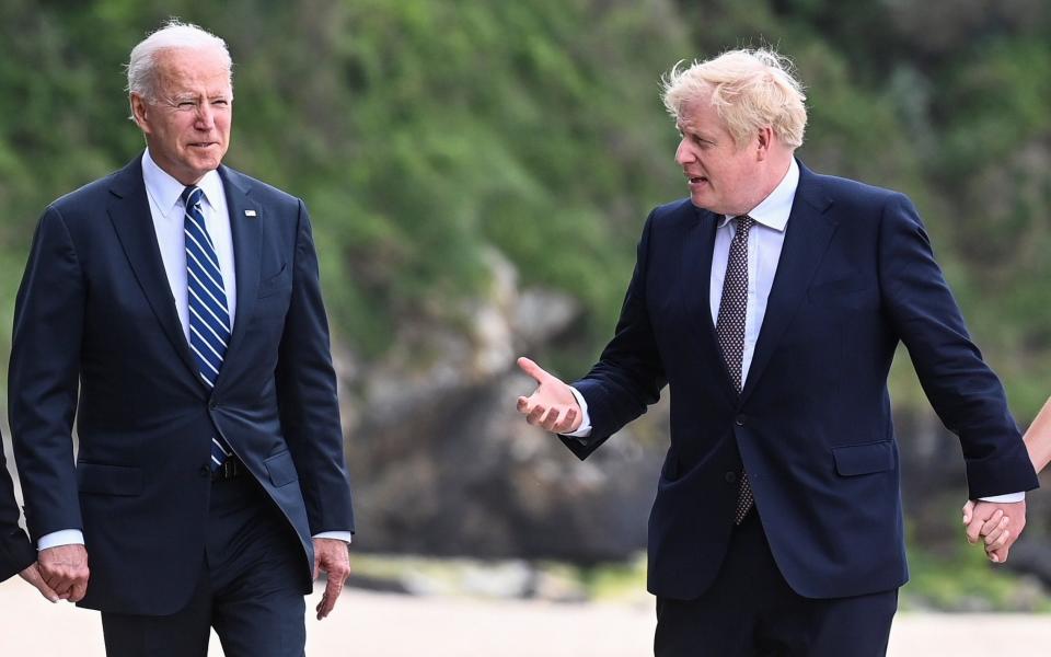 Joe Biden, left, and Boris Johnson during a walkabout on Thursday ahead of the G7 summit