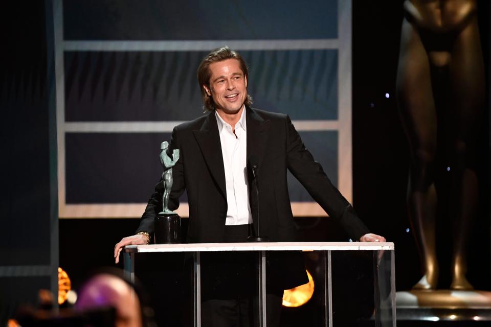 Brad Pitt accepts the award for outstanding performance by a male actor in a supporting role for his role as Cliff Booth in “Once Upon a Time in Hollywood” during the 26th Annual Screen Actors Guild Awards.