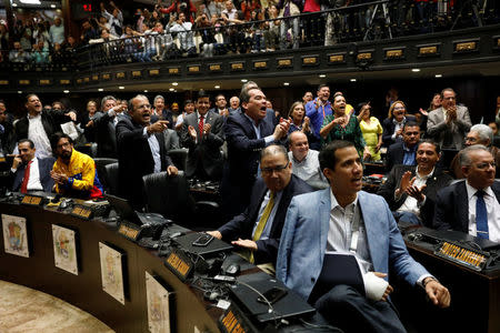 Deputies of the Venezuelan coalition of opposition parties (MUD) shout slogans during a session of the National Assembly in Caracas, Venezuela April 5, 2017. REUTERS/Carlos Garcia Rawlins