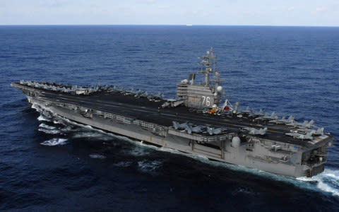 The aircraft carrier USS Ronald Reagan  - Credit:  Reuters