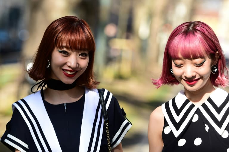 Girls in the street outside Dolce & Gabbana's Fall/Winter 2017/2018 show in Milan