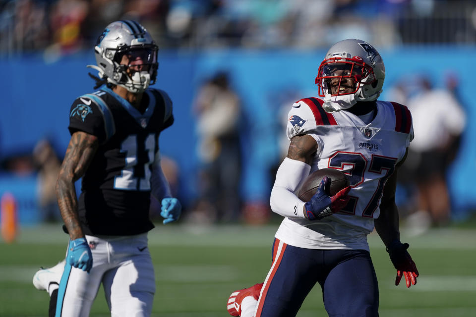 New England Patriots cornerback J.C. Jackson runs for a touchdown after an interception against the Carolina Panthers during the second half of an NFL football game Sunday, Nov. 7, 2021, in Charlotte, N.C.(AP Photo/John Bazemore)