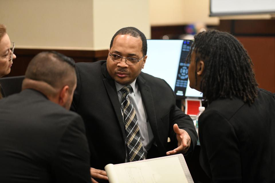 Henry Segura discusses with his attorneys whether he should have his family take the stand in his defense for the sentencing phase of his trial. Segura was convicted on four counts of first-degree murder on Tuesday, Nov. 19, 2019. 