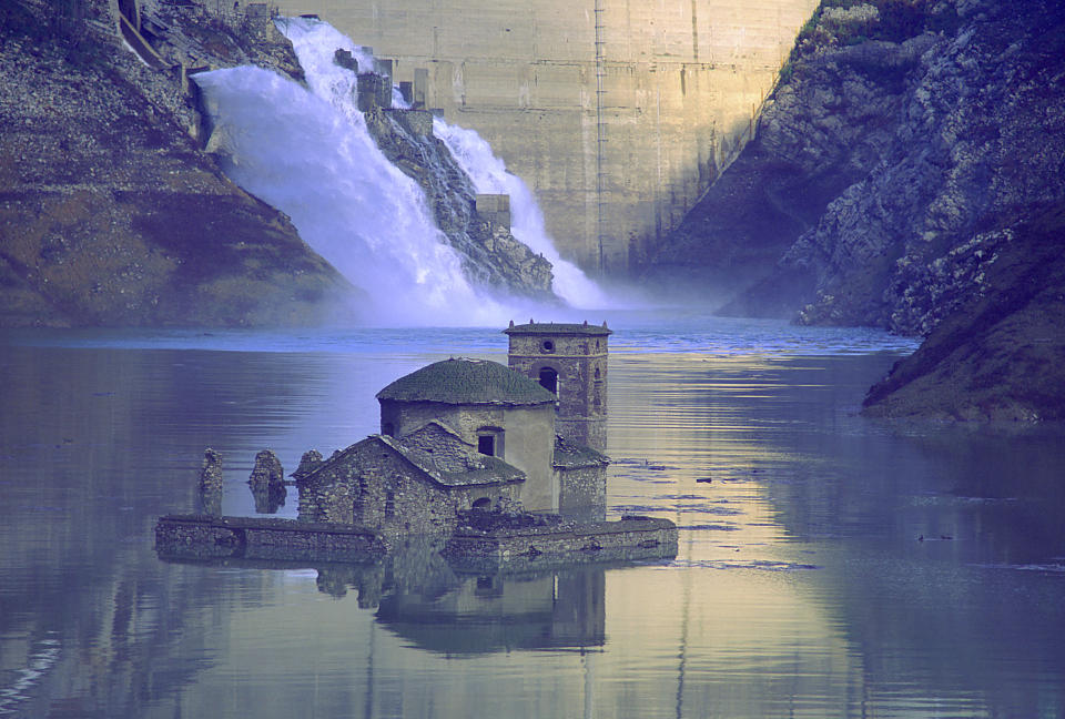 Italy, the village of Fabbriche di Careggine, at the foothills of the Apuan Alps (Tuscany), lays completely submerged by water as a dam was built next to it. But every decade, for maintenance reasons, the basin, now called Lake Vagli, must be drained and the village reappears like a ghost. (Photo by Romano Cagnoni/Getty Images)