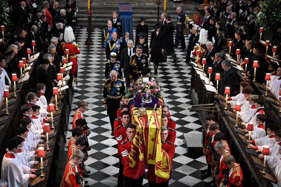 <p>Britain's King Charles III (L), Britain's Camilla, Queen Consort, Britain's Princess Anne, Princess Royal, Vice Admiral Timothy Laurence, Britain's Prince Andrew, Duke of York, Britain's Prince Edward, Earl of Wessex, Britain's Sophie, Countess of Wessex, Britain's Prince William, Prince of Wales, Britain's Prince George of Wales, Britain's Catherine, Princess of Wales, Britain's Prince Harry, Duke of Sussex and Britain's Meghan, Duchess of Sussex walk behind the coffin of Britain's Queen Elizabeth II as they leave Westminster Abbey in London on September 19, 2022, after the State Funeral Service for Britain's Queen Elizabeth II. (Photo by Ben Stansall / POOL / AFP) (Photo by BEN STANSALL/POOL/AFP via Getty Images)</p> 