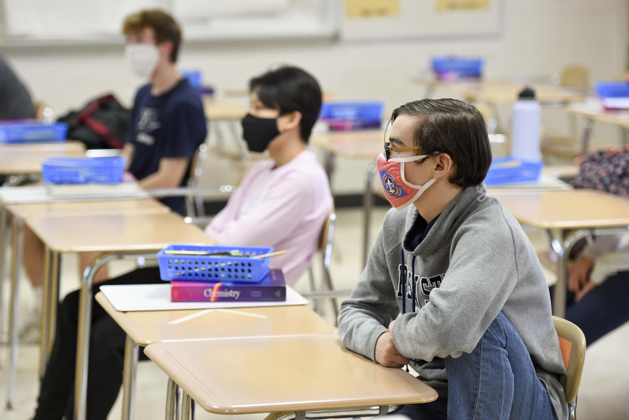 Students attend school, with safety precautions, in Pennsylvania. A new study of hospitalization rates in counties where schools have reopened suggests in-person learning might be safer than previously thought.