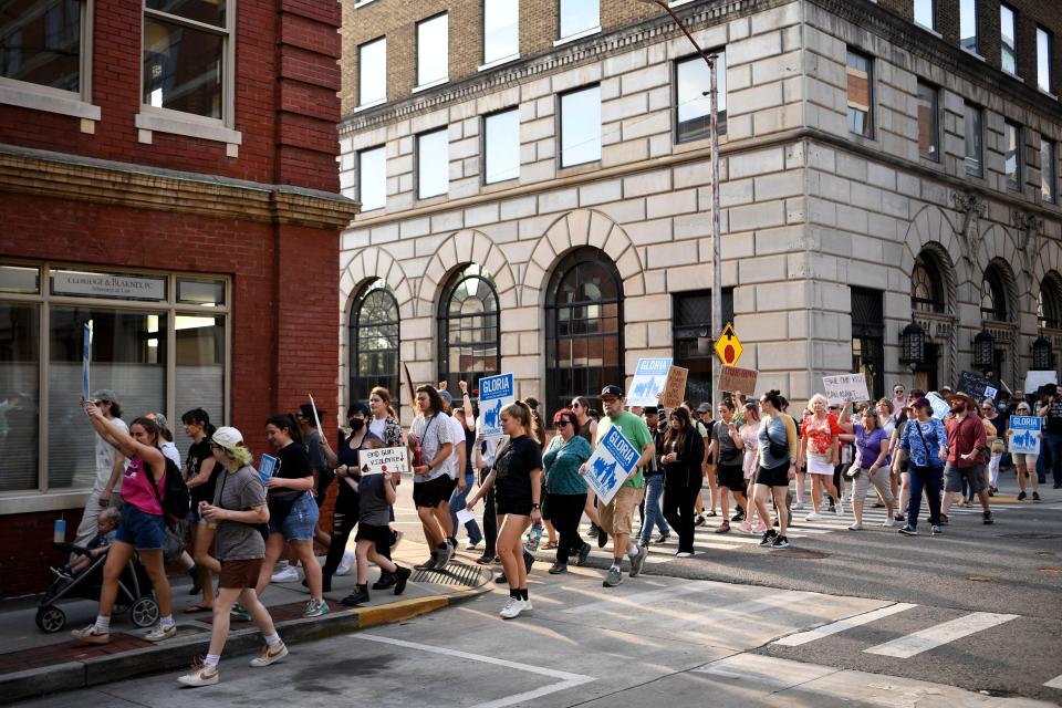 Close to 150 people marched in Downtown Knoxville on April 4, 2023, to show their support for Rep. Gloria Johnson and to demonstrate against gun violence. By one vote, Johnson was spared from expulsion from the legislature.