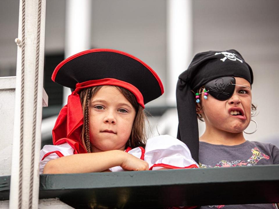 Two children dressed up as pirates.