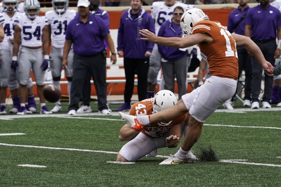 Texas place kicker Cameron Dicker (17) kicks a field goal against Kansas State during the second half of an NCAA college football game in Austin, Texas, Friday, Nov. 26, 2021. (AP Photo/Chuck Burton)