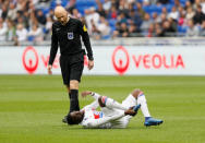 Soccer Football - Ligue 1 - Olympique Lyonnais v FC Nantes - Groupama Stadium, Lyon, France - April 28, 2018 Lyon's Tanguy Ndombele after sustaining an injury REUTERS/Emmanuel Foudrot