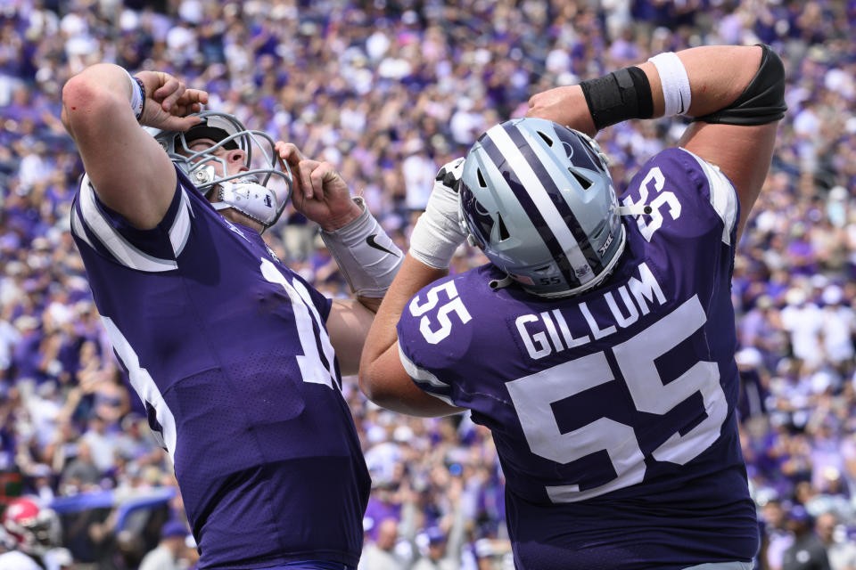Kansas State quarterback Will Howard, left, celebrates his rushing touchdown against Troy with offensive lineman Hayden Gillum (55) during the second half of an NCAA college football game in Manhattan, Kan., Saturday, Sept. 9, 2023. (AP Photo/Reed Hoffmann)