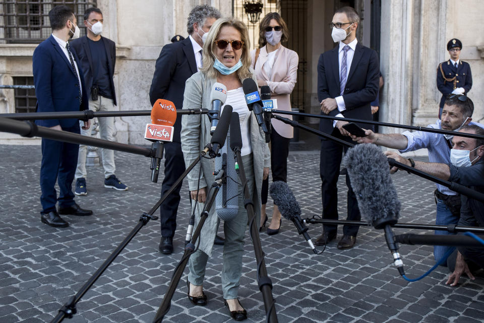 FILE - In this June 12, 2020 file photo, lead prosecutor Maria Cristina Rota talks with reporters as the leaves Palazzo Chigi premier's office, in Rome. Prosecutors from northern Italy have traveled to Rome again Thursday, Jan. 28, 2021, to question the health minister and others as part of their broadening investigation into whether to lay any criminal blame for Italy’s horrific coronavirus toll. Back in June, Bergamo prosecutors questioned Premier Giuseppe Conte, Health Minister Roberto Speranza and other top officials about the delayed lockdown in two Bergamo towns where infections were reported in the early days of Italy’s outbreak. Bergamo subsequently became the Italy’s COVID-19 epicenter, the first in the West, registering a 571% excess mortality rate in March compared to the average of the previous five years. (Roberto Monaldo/LaPresse via AP)