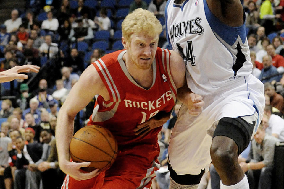 FILE - Former Houston Rockets' Chase Budinger, left, drives around Minnesota Timberwolves' Anthony Tolliver during the second half of an NBA basketball game on Wednesday, April 13, 2011 in Minneapolis. (AP Photo/Jim Mone, File)