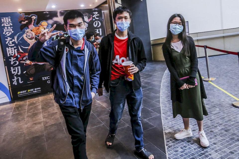 Zenyx (centre), Brayden (left) and Viki (right) speaking to Malay Mail reporters at Mid Valley shopping center cinema, March 5, 2021. ― Picture by Hari Anggara