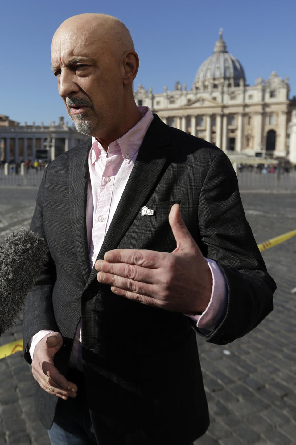Peter Isely, founding member of the ECA (Ending Clergy Abuse) is interviewed by The Associated Press in St. Peter's Square at the Vatican, Sunday, Feb. 17, 2019. Pope Francis is asking for prayers for this week's sex abuse summit at the Vatican, calling abuse an "urgent challenge of our time", and told pilgrims and other visitors Sunday in St. Peter's Square that beginning Thursday, the heads of episcopal conferences worldwide will discuss "protection of minors in the church." (AP Photo/Gregorio Borgia)