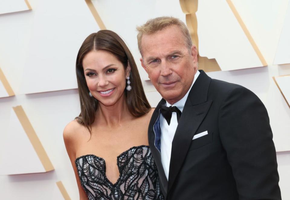 hollywood, california march 27 l r christine baumgartner and kevin costner attend the 94th annual academy awards at hollywood and highland on march 27, 2022 in hollywood, california photo by david livingstongetty images