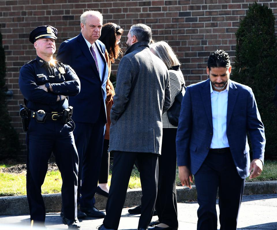 Interim Police Chief Paul Saucier, Mayor Joseph Petty and City Manager Erica Batista wait outside Callahan Fay & Caswell Funeral Home for the wake of Chasity and Zella Nuñez on Thursday.