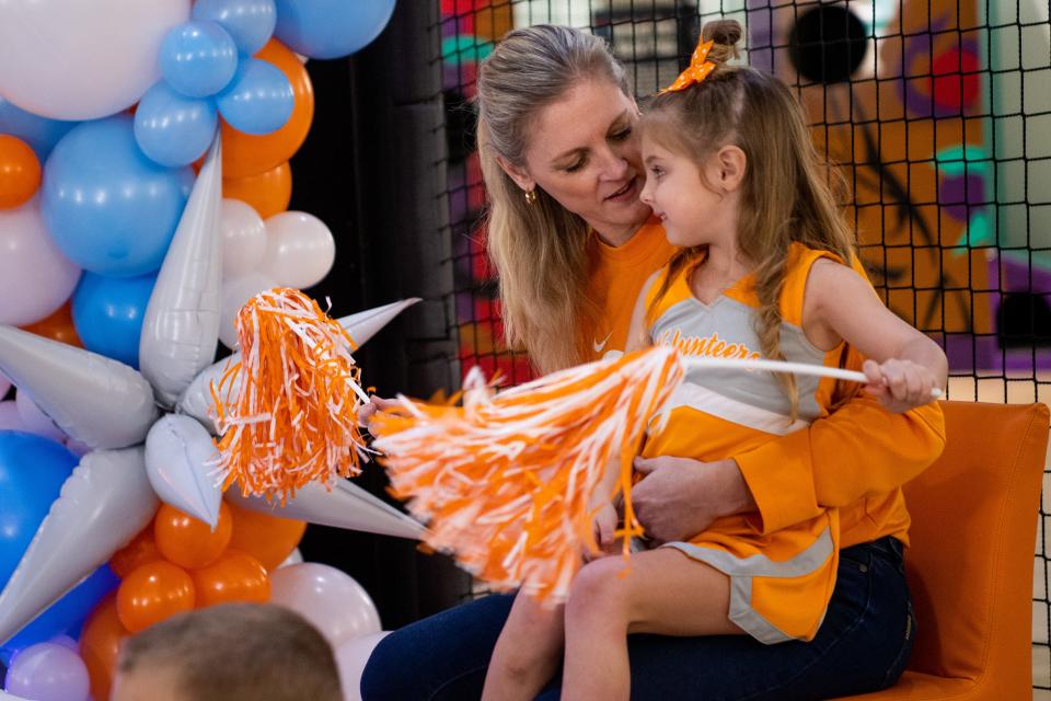 Tennessee head coach Kellie Harper with her daughter Kiley during a Selection Sunday watch party held at the Women's Basketball Hall of Fame in downtown Knoxville on Sunday, March 12, 2023. 