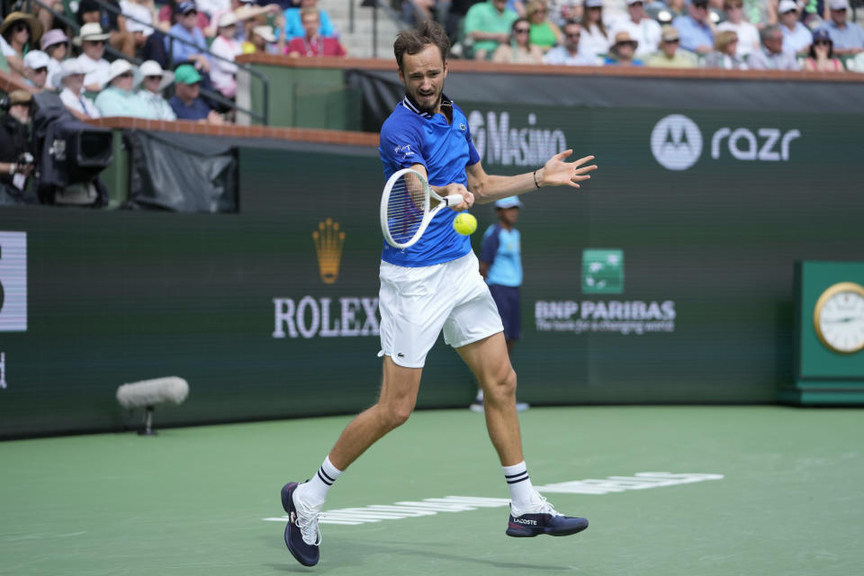 Daniil Medvedev, of Russia, returns to Carlos Alcaraz, of Spain, during the final match at the BNP Paribas Open tennis tournament, Sunday, March 17, 2024, in Indian Wells, Calif. (AP Photo/Ryan Sun)