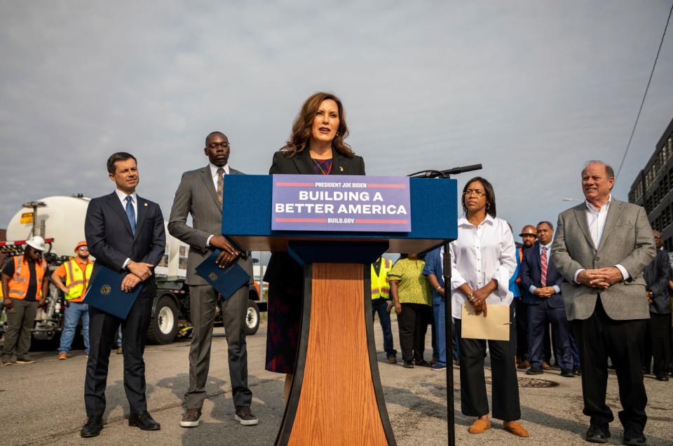 Michigan Gov. Gretchen Whitmer talks with city officials, news media members and local community residents during a news conference in Detroit on Thursday, Sept. 15, 2022.