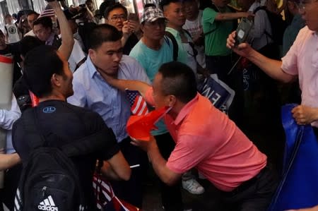 People engage in scuffles outside Grand Hyatt hotel, where Taiwan's President Tsai Ing-wen is supposed to stay during her visit to the U.S., in New York City