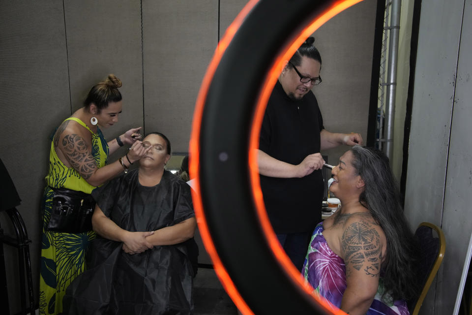 Jasmine Lobitos-Cartwright, left, applies makeup to Leikia Williams as Kaimi Ehia, second from right, helps prepare Hinaleimoana Wong-Kalu before the Mahu Magic drag show at the Western Regional Native Hawaiian Convention, Tuesday, June 20, 2023, in Las Vegas. The show was held as reminder and celebration of the respected place gender fluidity has held in Hawaiian culture for hundreds of years. (AP Photo/John Locher)