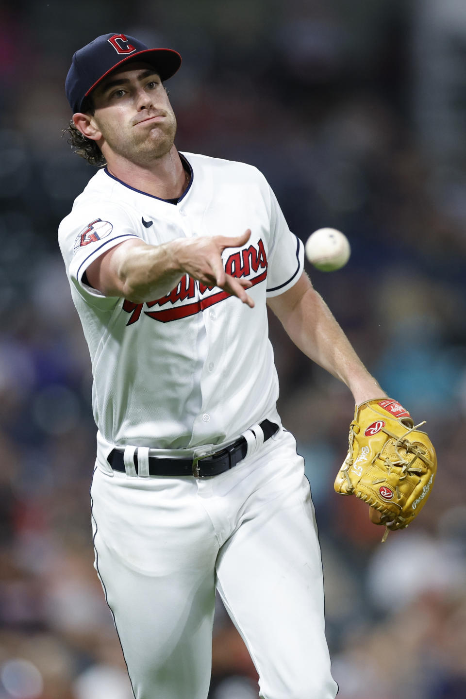 Cleveland Guardians starting pitcher Shane Bieber throws out Chicago White Sox's Yasmani Grandal at first base during the fourth inning of a baseball game Saturday, Aug. 20, 2022, in Cleveland. (AP Photo/Ron Schwane)
