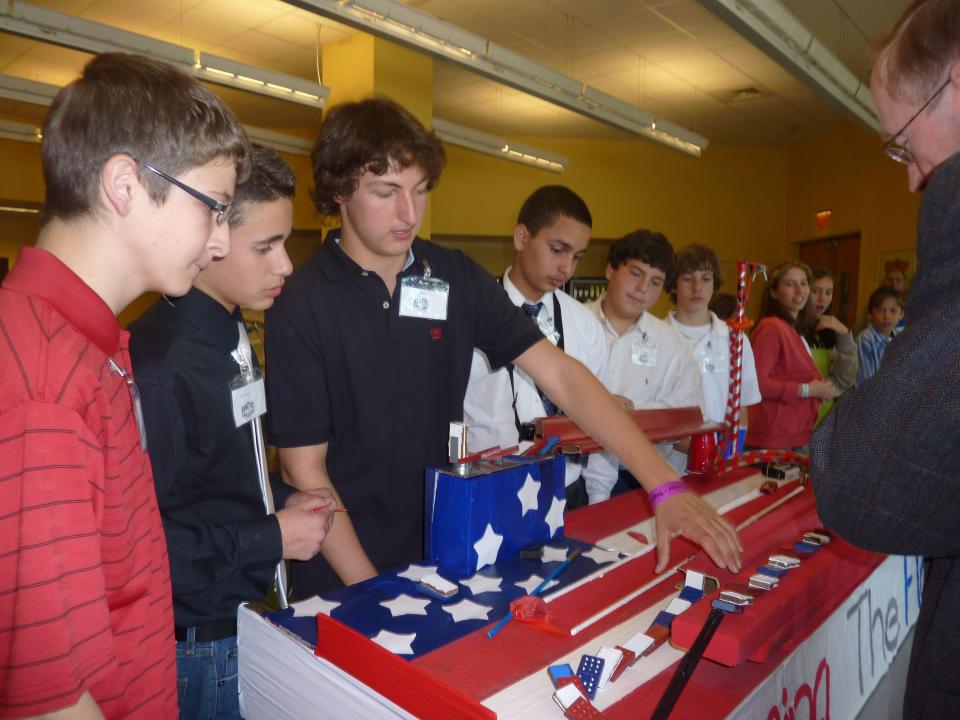 The annual tournament focuses on a middle school student’s ability to transform everyday objects into kinetic systems modeled after Rube Goldberg’s machines.