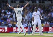 Ollie Robinson (left) celebrates a wicket