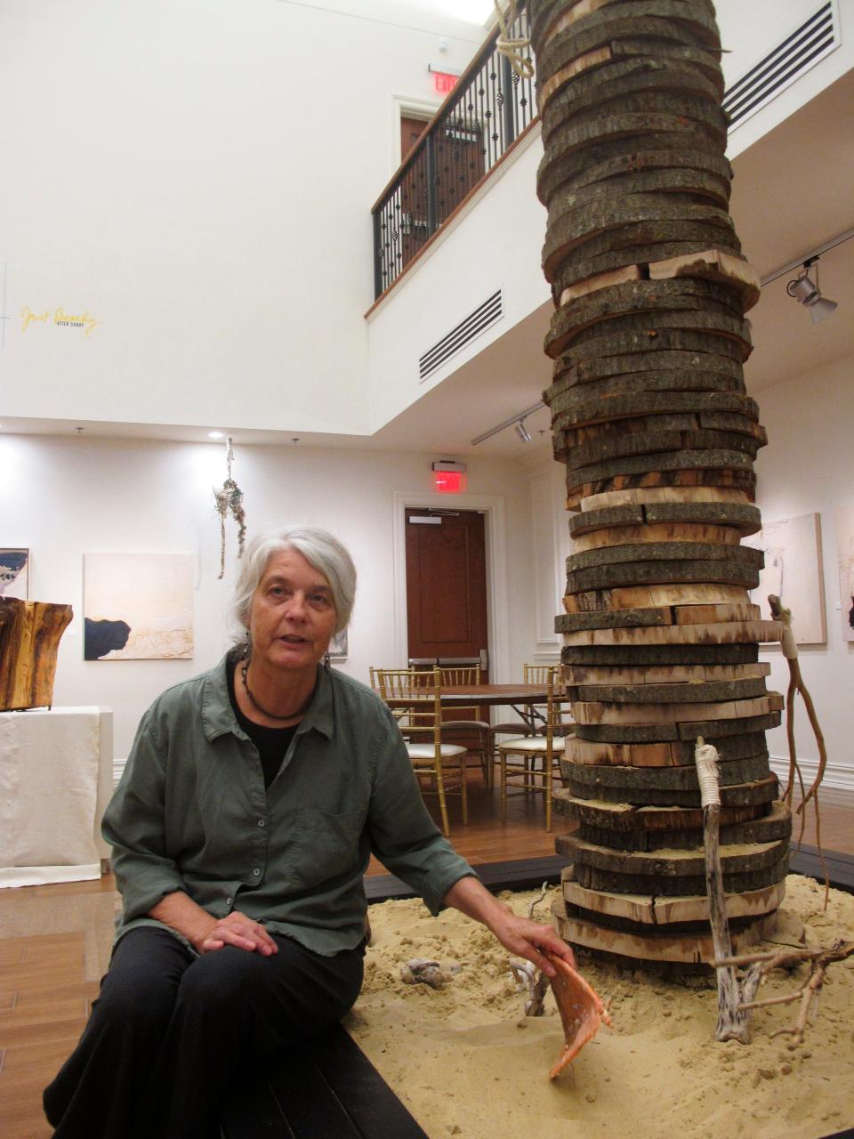 Karen Bright, a professor at Monmouth University, with a Superstorm Sandy-themed art exhibit she and another professor created in West Long Branch, N.J.