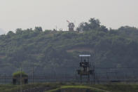 Military guard posts of North Korea, rear, and South Korea, foreground, are seen in Paju, at the border with North Korea, South Korea, Tuesday, June 16, 2020. North Korea blew up an inter-Korean liaison office building just inside its border in an act Tuesday that sharply raises tensions on the Korean Peninsula amid deadlocked nuclear diplomacy with the United States. (AP Photo/Ahn Young-joon)