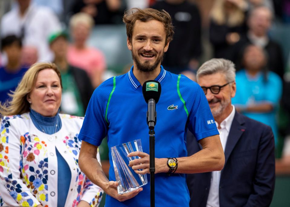 Daniil Medvedev of Russia accepts his finalist trophy after coming up short to Carlos Alcaraz of Spain in the men's singles final at the BNP Paribas Open of the Indian Wells Tennis Garden in Indian Wells, Calif., Sunday, March 19, 2023. 