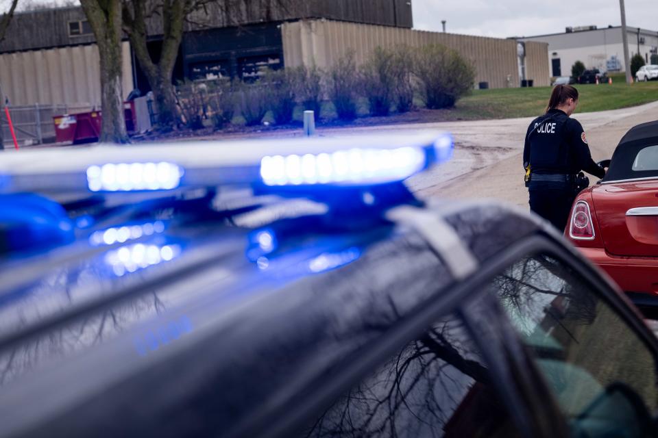 An Urbandale police officer makes a traffic stop Monday, March 25, 2024.