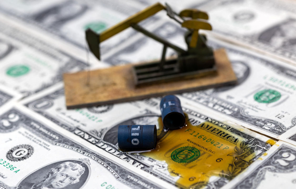 Oil, miniatures of oil barrels, oil pump jack and U.S. dollar banknote are seen in this illustration taken, June 6, 2023. REUTERS/Dado Ruvic/Illustration