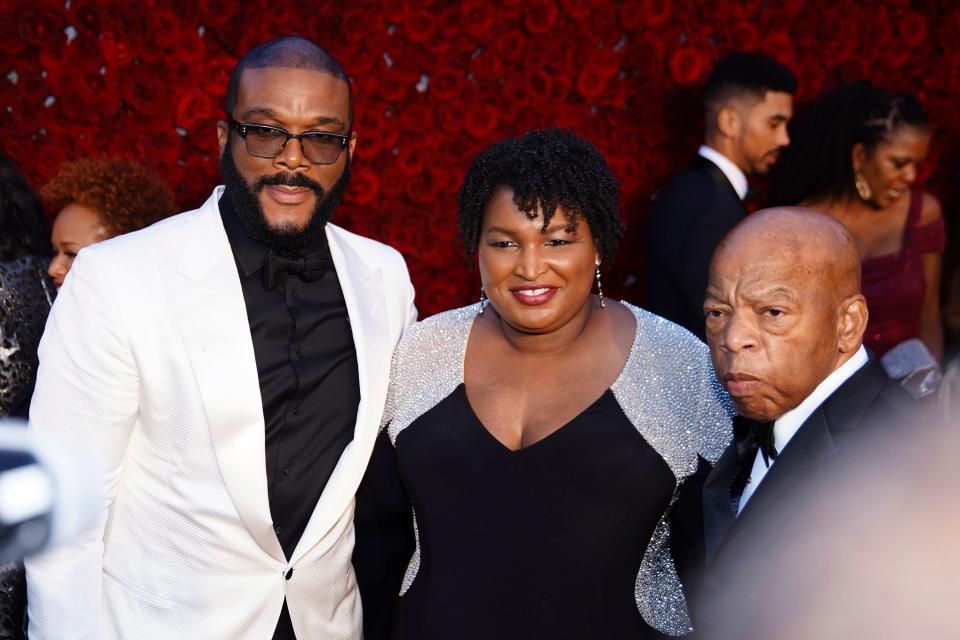 Tyler Perry, Stacey Abrams, and U.S. Rep. John Lewis, D-Ga., pose for a photo on the red carpet at the grand opening of Tyler Perry Studios, Saturday, Oct. 5, 2019, in Atlanta.