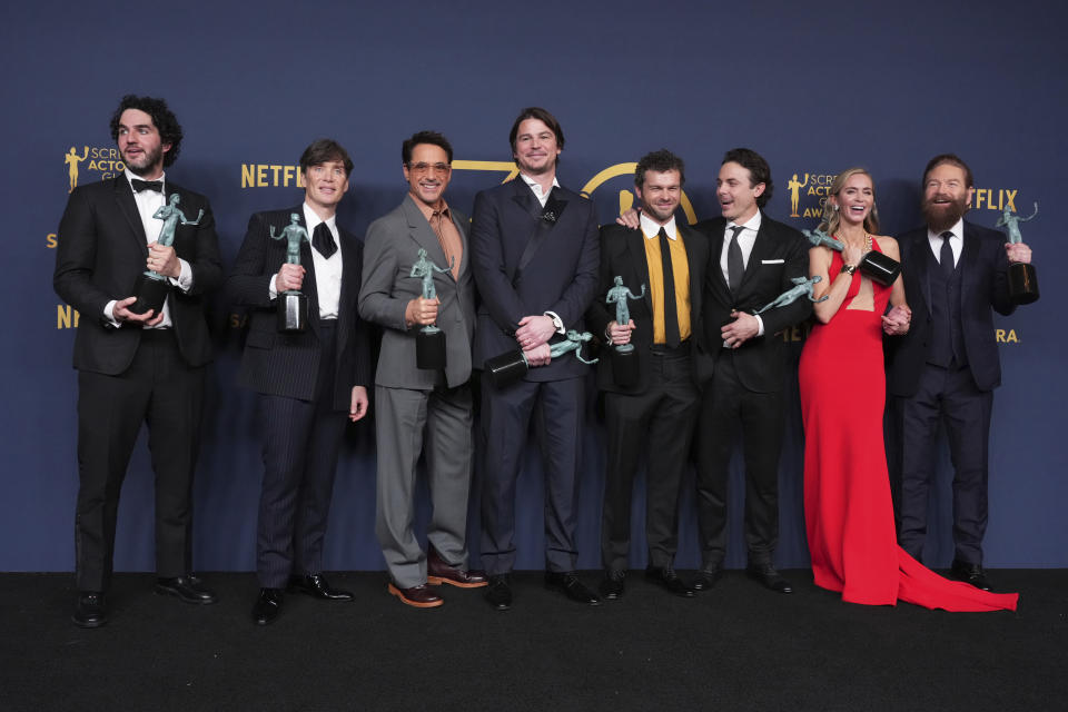 Benny Safdie, from left, Cillian Murphy, Robert Downey Jr., Josh Hartnett, Alden Ehrenreich, Casey Affleck, Emily Blunt, and Kenneth Branagh, winners of the award for the award for outstanding performance by a cast in a motion picture for "Oppenheimer," pose in the press room during the 30th annual Screen Actors Guild Awards on Saturday, Feb. 24, 2024, at the Shrine Auditorium in Los Angeles. (Photo by Jordan Strauss/Invision/AP)
