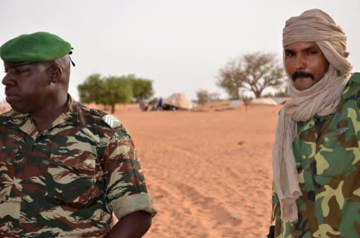 Malian deserters in a camp near Niamey on May 25, where some 500 hundred soldiers who fled from Mali's army after an offensive by Tuareg and Islamist rebels. The deserters were being guarded by Niger's army. A move by Mali's Tuareg and Islamist rebels to merge and declare a new state in the north has left the west African country closer to breakup -- two months after a fateful coup in the south