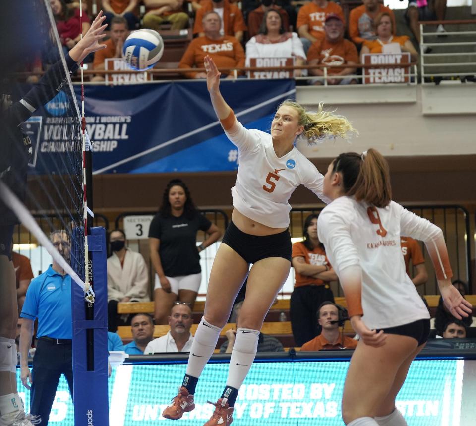 Texas middle blocker Bella Bergmark, coming off the bench, spikes a shot during Thursday's win over Marquette. She hadn't played much through the first two NCAA rounds. "I told them that we're going to need to rely on some people coming off the bench, and she did a phenomenal job," UT coach Jerritt Elliott said.