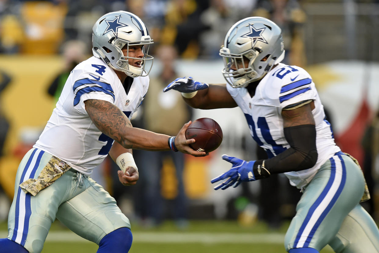 FILE - In this Sunday, Nov. 13, 2016 file photo, Dallas Cowboys quarterback Dak Prescott (4) hands the ball off to running back Ezekiel Elliott (21) during the first half of an NFL football game against the Pittsburgh Steelers in Pittsburgh. Rookie sensations Dak Prescott and Ezekiel Elliott made the playoffs with four games to spare in Dallas. The Cowboys and their young stars could clinch everything else, topped by home-field advantage throughout the playoffs with three games remaining if they beat the New York Giants on Sunday night, Dec. 11, 2016 and get some help. (AP Photo/Don Wright, File)